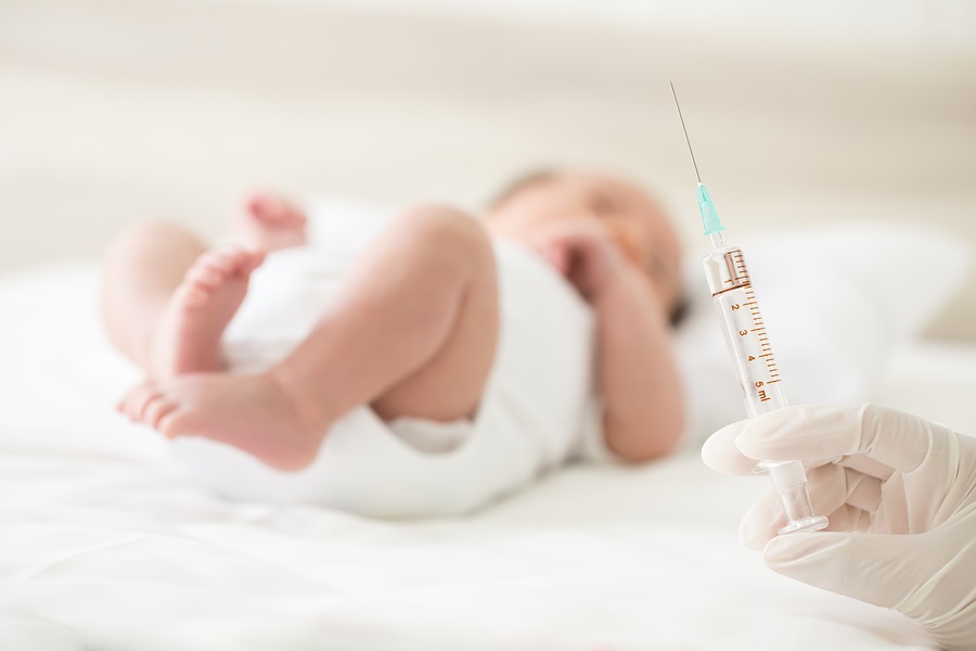 Vaccine for infant in hospital with doctor