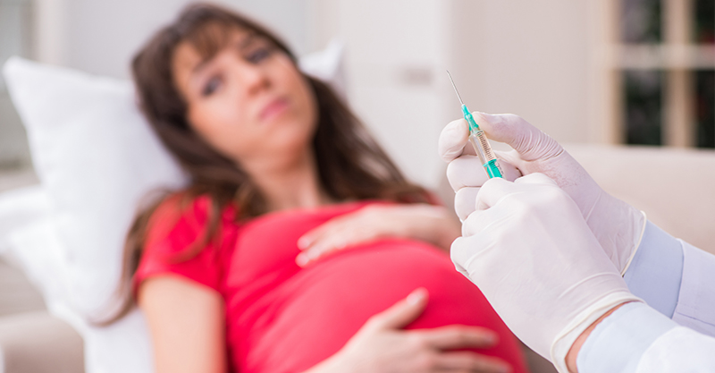 Pregnant woman patient visiting doctor for regular check-up
