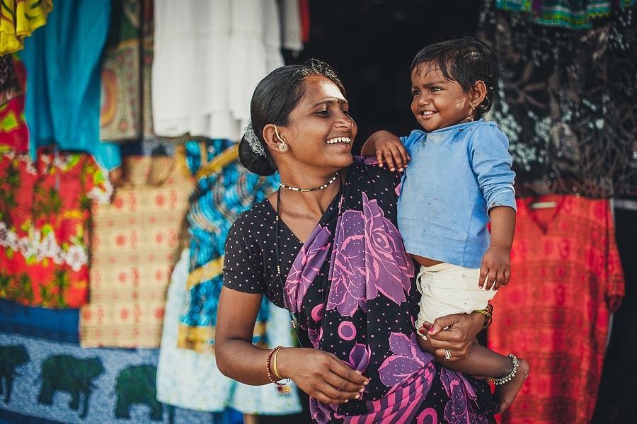 India, Goa, the village of Benaulim - photo of unidentified Indian woman and baby in her arms
